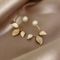 Korean fashion alloy pearl and leaf stud earrings.