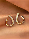 Gold-plated, heart-shaped half hoop earrings