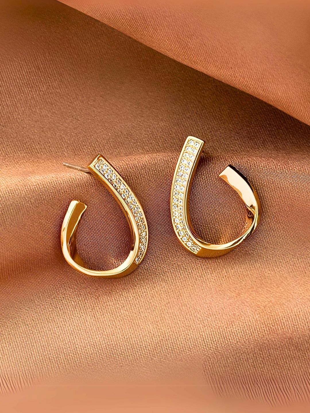 Gold-plated, heart-shaped half hoop earrings