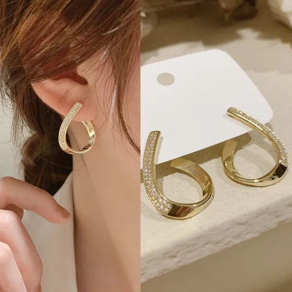 Gold-plated, heart-shaped half hoop earrings