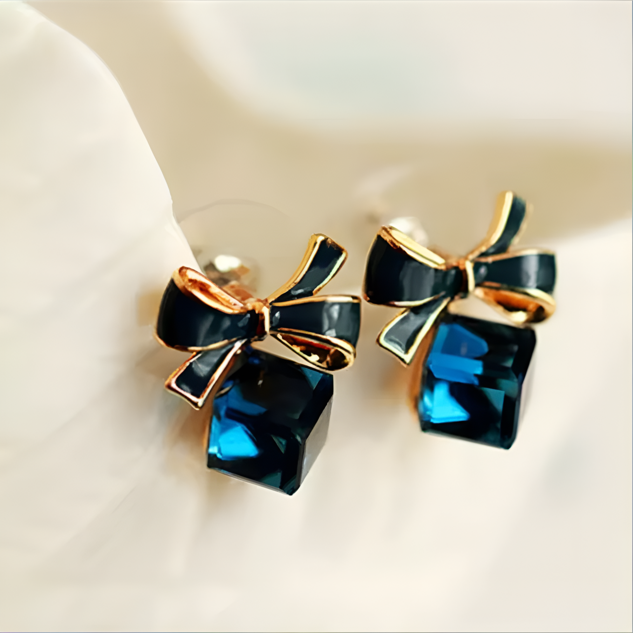 faux crystal bowknot cube ear studs